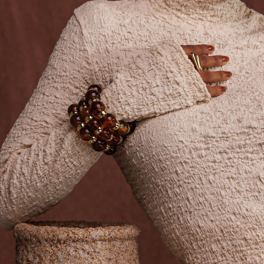 Pulseira de Esferas Marrom com Argolas em Dourado - (Unidade)