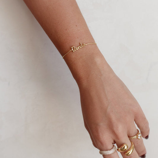 Pulseira Regulável com Escrita Dinda Dourado